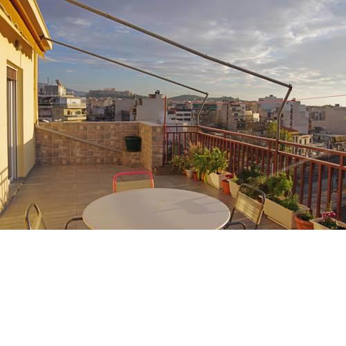 A cozy bedroom in a penthouse with Acropolis view