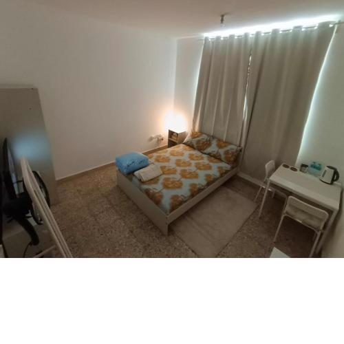 Affordable transient - not a hotel - sharing kitchen and washrooms
