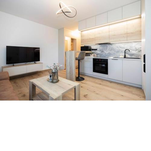ALURE RESIDENCES 9 & 24h self check-in, private parking in front of the apartment building included, new building, terrace, the apartment building has its own park with a lake and outdoor fitness, children's playground, CITY CENTER