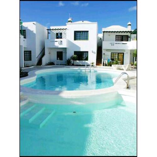 Apartment with 2 bedrooms in Tias with shared pool and enclosed garden 500 m from the beach