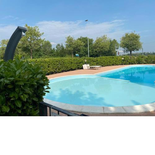 Appartamento Il Faro con giardino in Residence con piscina
