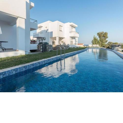 Attractive Holiday Home in Gennadi with Shared Swimming Pool