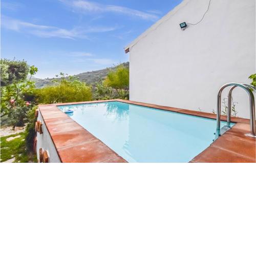 Awesome home in Málaga with Outdoor swimming pool, WiFi and 2 Bedrooms