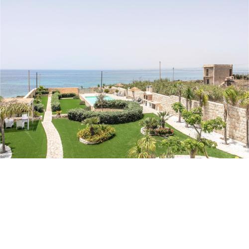 Awesome home in Pachino with Outdoor swimming pool, WiFi and 4 Bedrooms