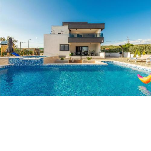Awesome home in Posedarje with Outdoor swimming pool, WiFi and 5 Bedrooms