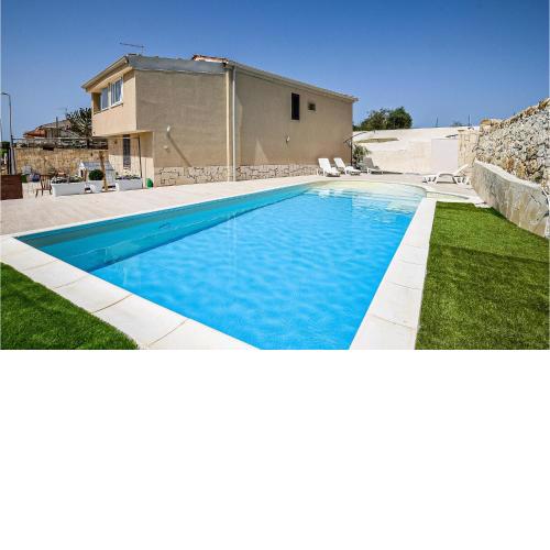 Beautiful home in Ragusa with Outdoor swimming pool, Private swimming pool and 2 Bedrooms