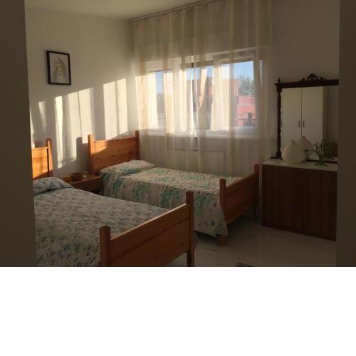 Camere in appartamento condiviso, vista sulla città