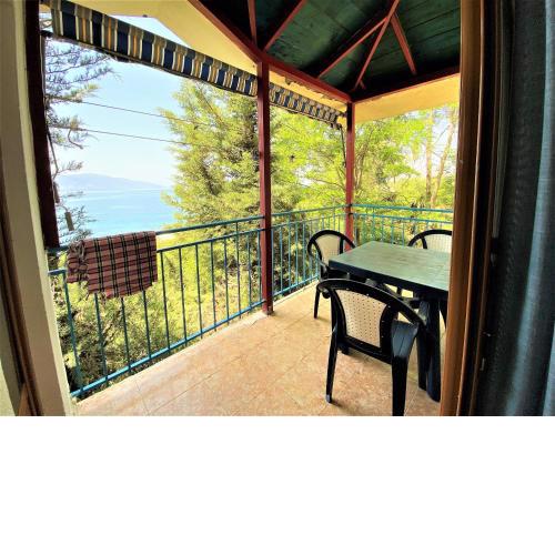First Room of Cozy Beachside Haven - Panoramic Radhime Retreat with Balcony Dining