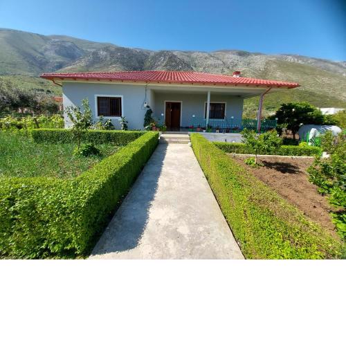 Flowery House near the Sea and the Mountain