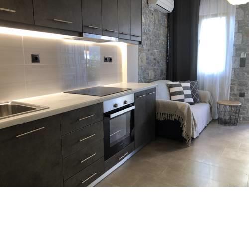 Ground floor apartment with stone decorated walls
