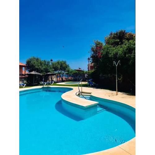 House with 3 bedrooms in Manilva with wonderful sea view shared pool enclosed garden 500 m from the beach