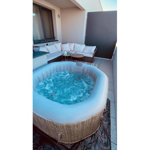 Jacuzzi area with sunset, terrace, free parking