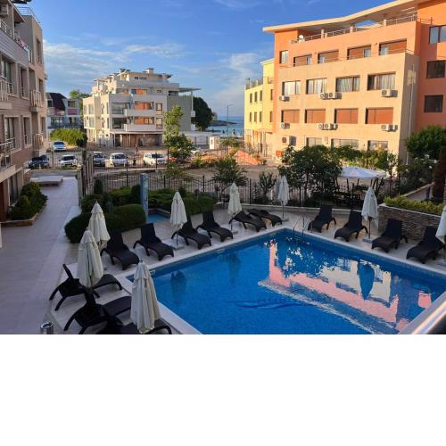 Modern 1BR Apartment with Sea View & Pool Included with Parking Space