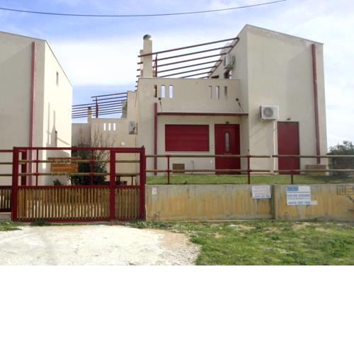 nemhouses near the airport and the sea in artemida