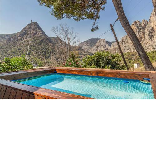 Nice home in Malaga with Outdoor swimming pool, WiFi and 2 Bedrooms