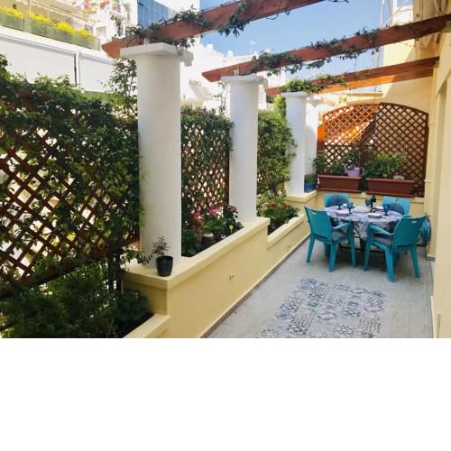 Oasis veranda under columns.Kolonaki embassy area.