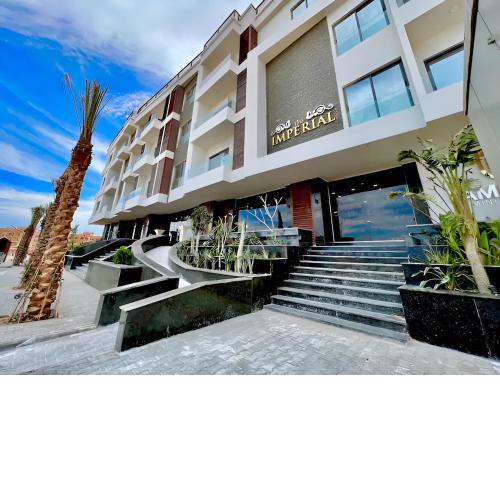 Sanctuary Sunlit Hurghada Haven with 4 Pools, Rooftop Sunsets & Gourmet Bites Steps Away