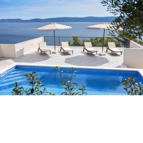 Seaside apartments with a swimming pool Marusici (Omis) - 10009