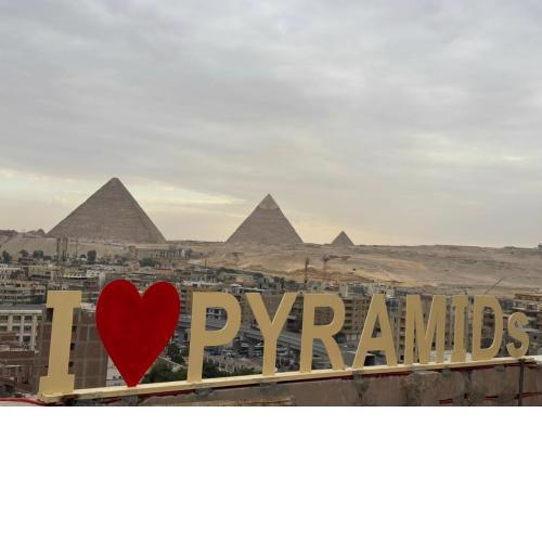 Separate hotel rooms with a view of the pyramids