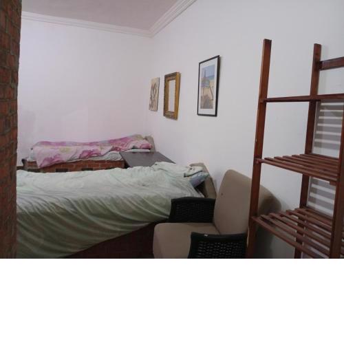 Small room with bathroom middle of town no AC no cooking facilities just for sleep