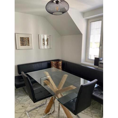Sunny Rooftop Apartment with huge terrace, Airconditioning and Parking garage