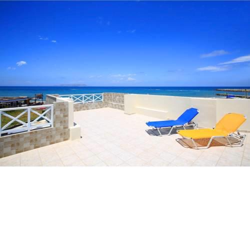 Swim, sunbathe, relax in beach front apt Iris