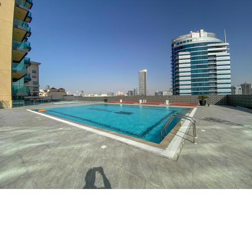 Urban Studio at The Square Tower Jumeirah Village Circle by Deluxe Holiday Homes